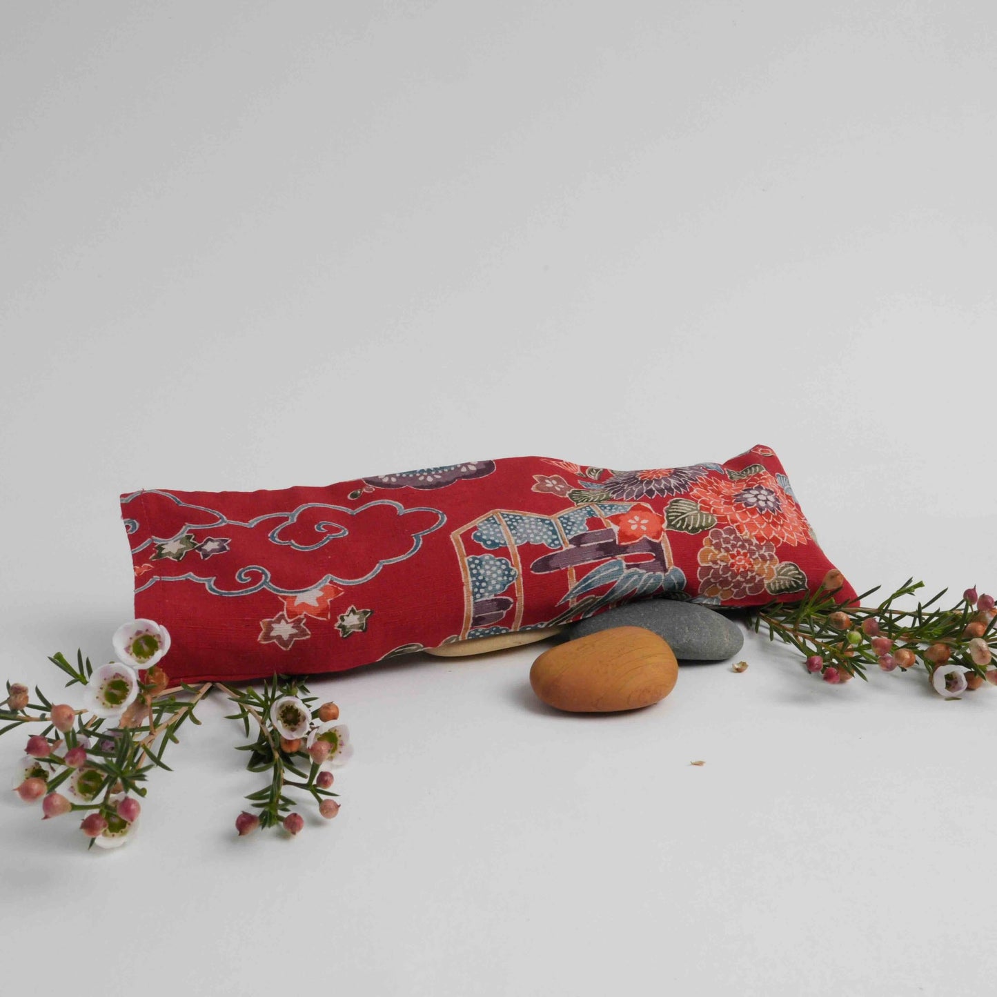 Eye pillow in Japanese silk from Momo, Japan. Exquisite hand printed silk fabric with pattern of clouds, chrysanthemums, cherry blossoms.