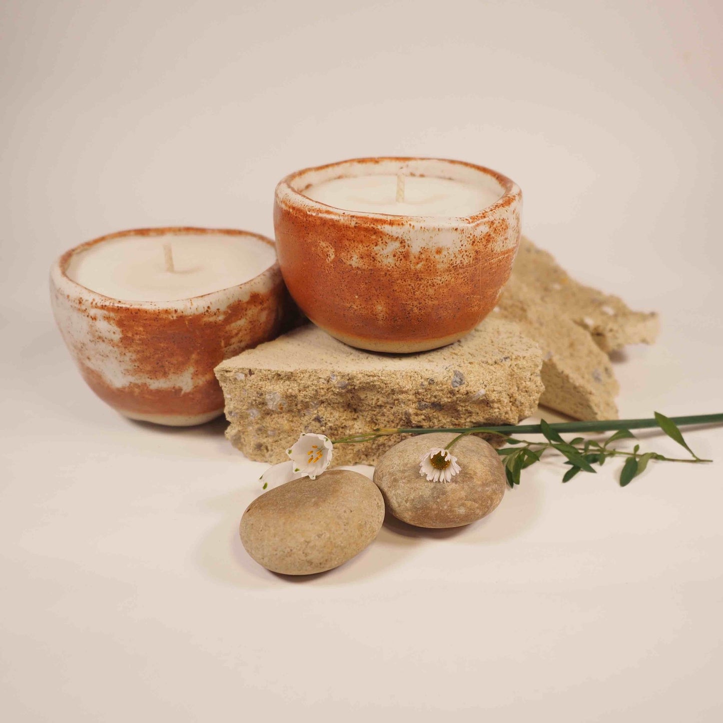 Ceramic candle pots in Shino ware glaze filled with coconut and soy wax.
