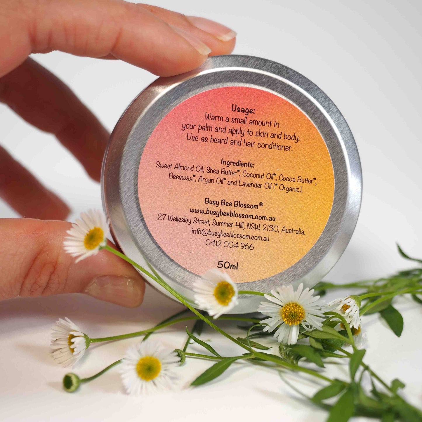 Underside of Organic Lavender Tattoo Balm tin showing ingredients, usage and contact details.