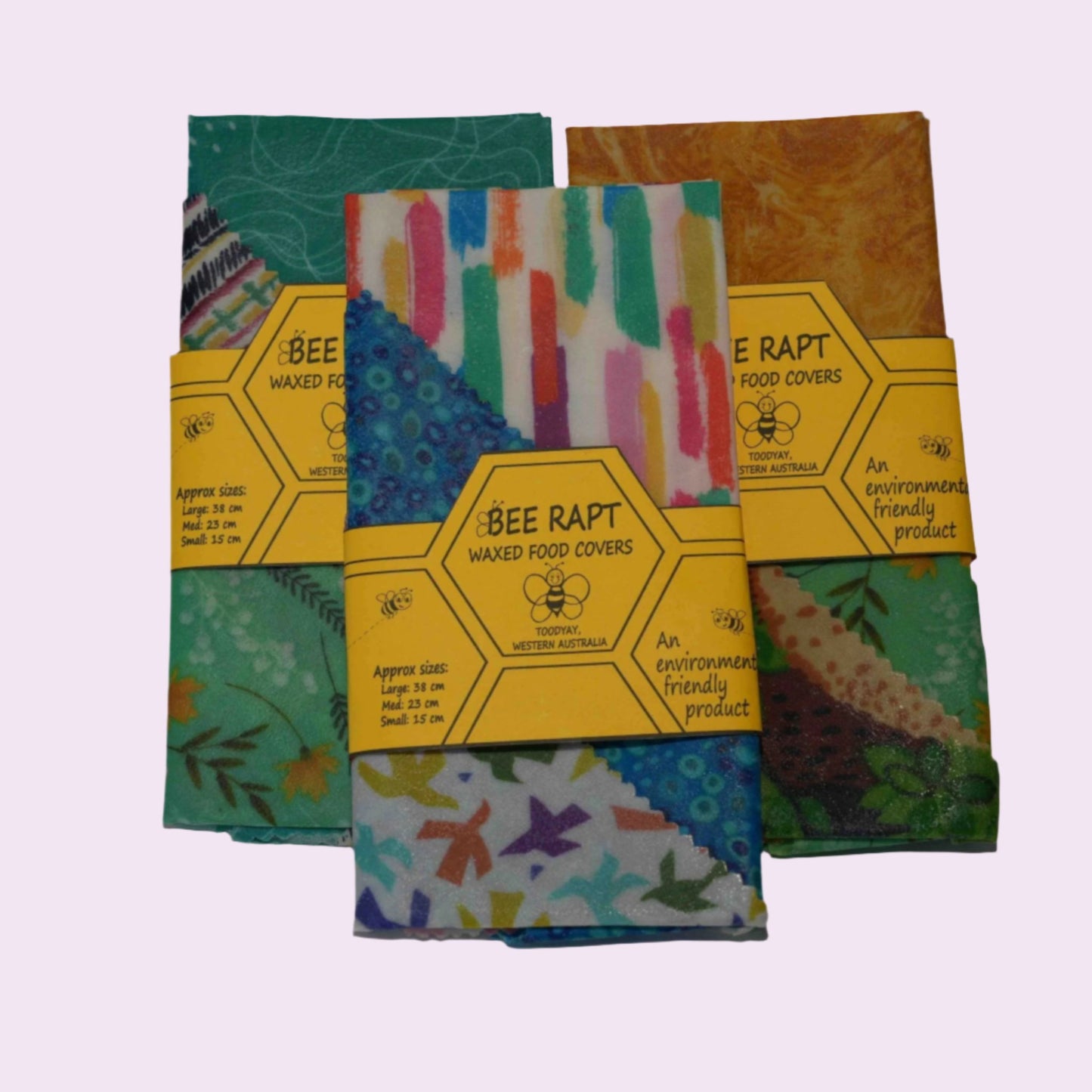 Sets of Bee Rapt food covers in green, striped and gold