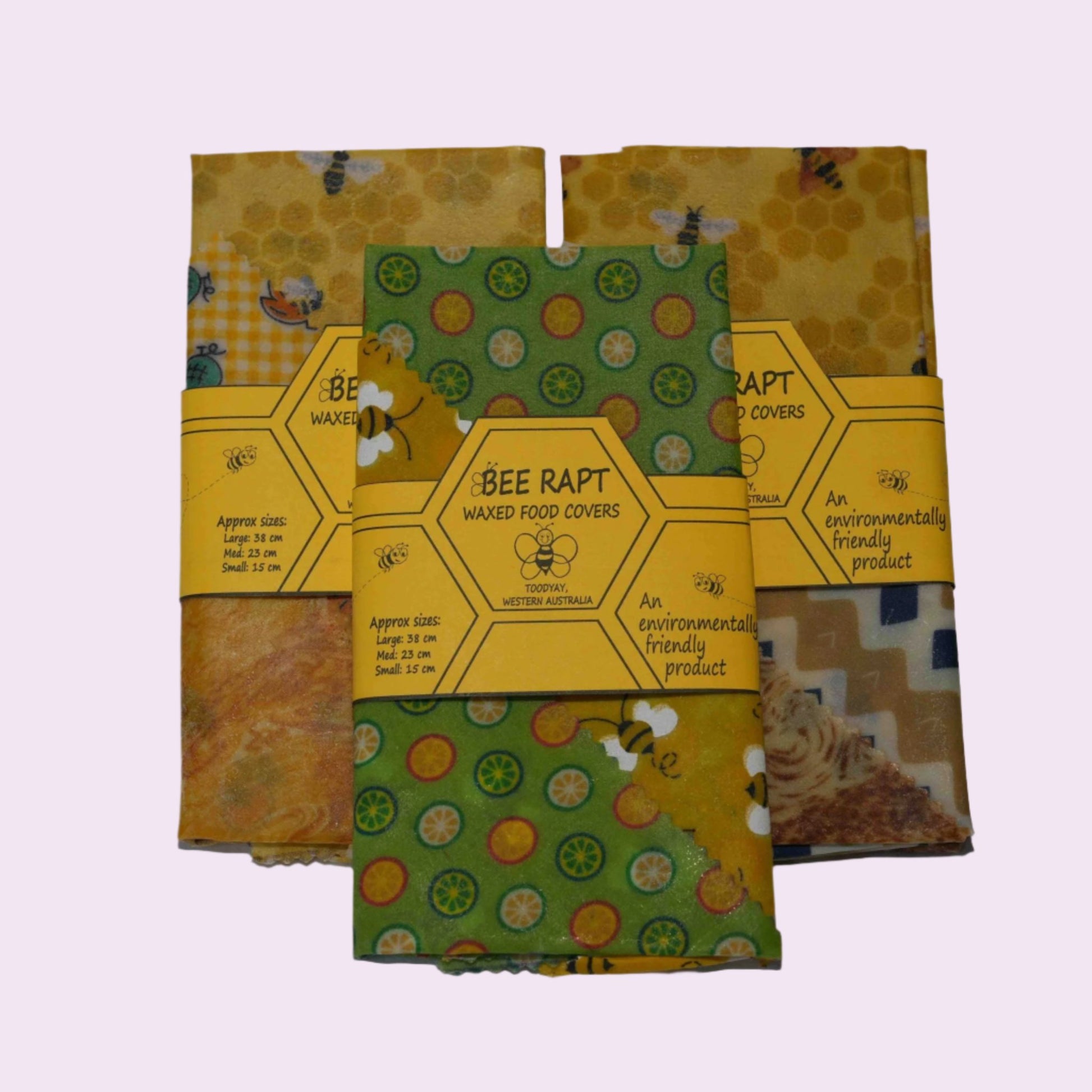 3 sets of Bee Rapt waxed food covers in orange and green