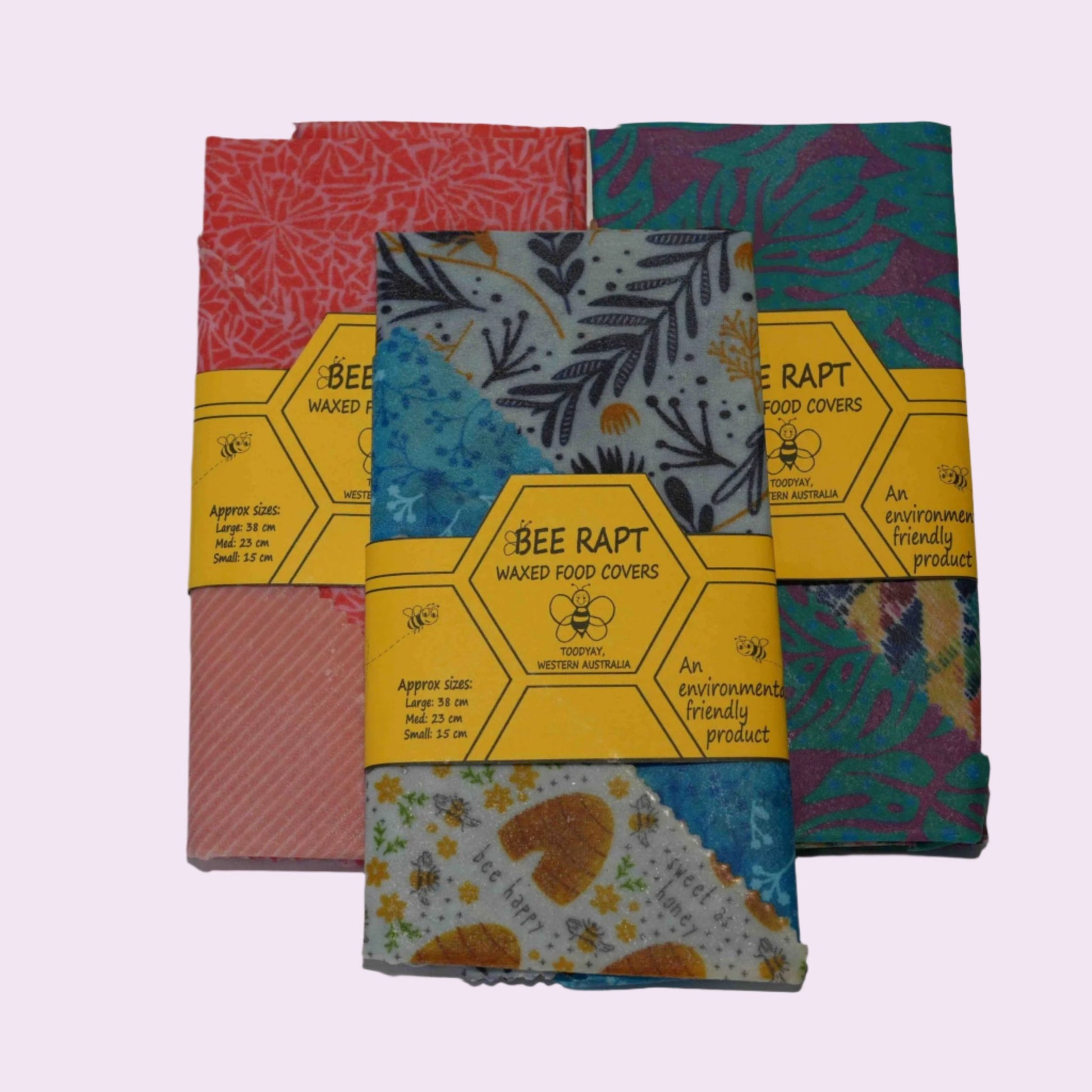 Sets of Bee Rapt food covers in red, blue and green