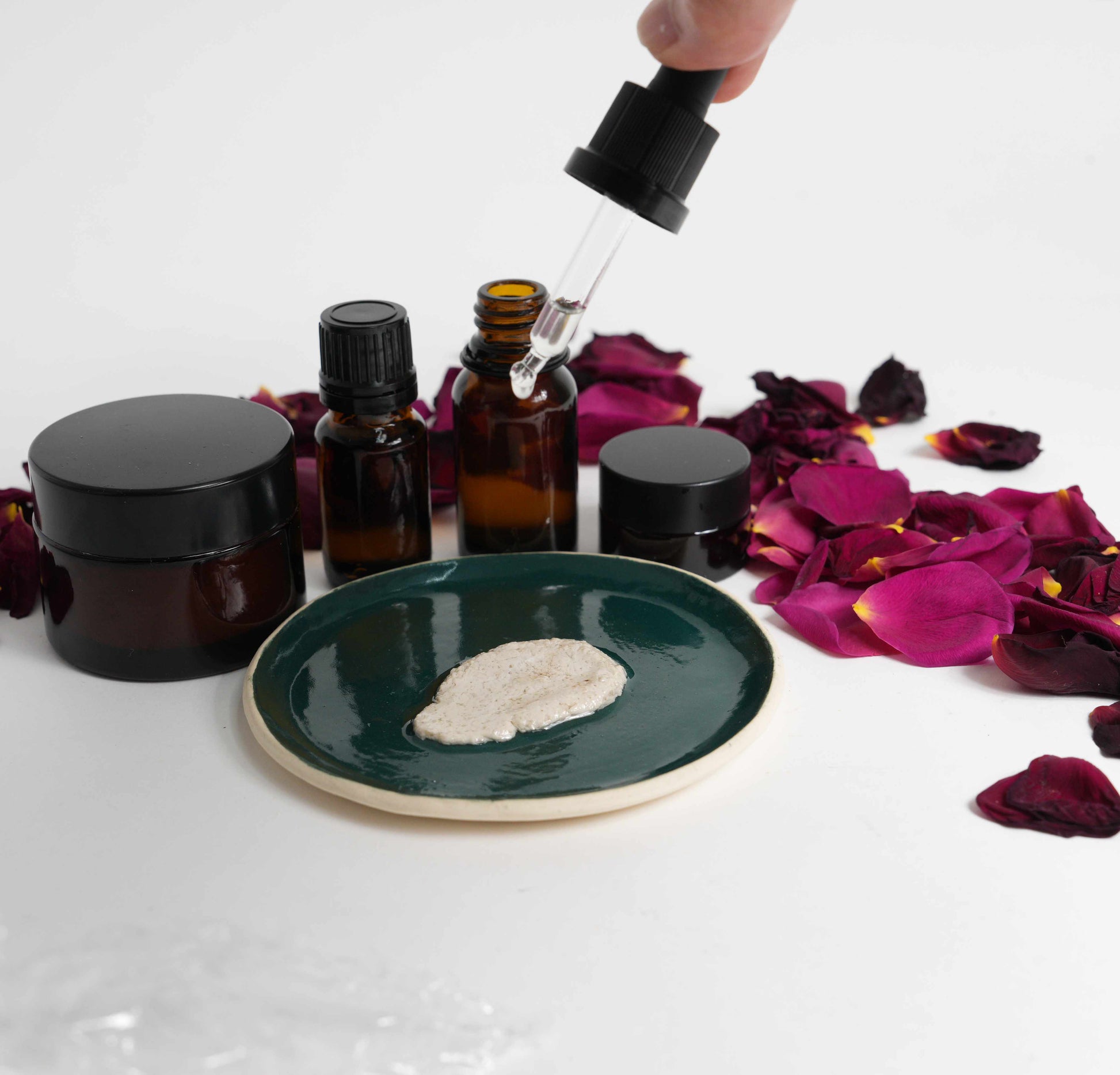 Apricot kernel oil face scrub with floral water dripping on scrub