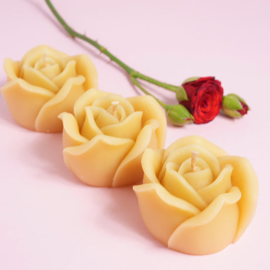Beeswax candles in rose design with a rose flower