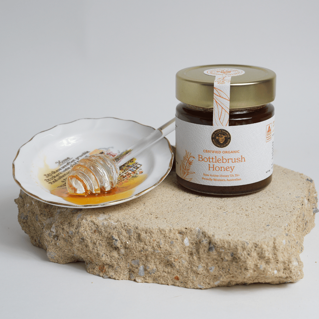 Certified organic bottlebrush honey with honey dripper