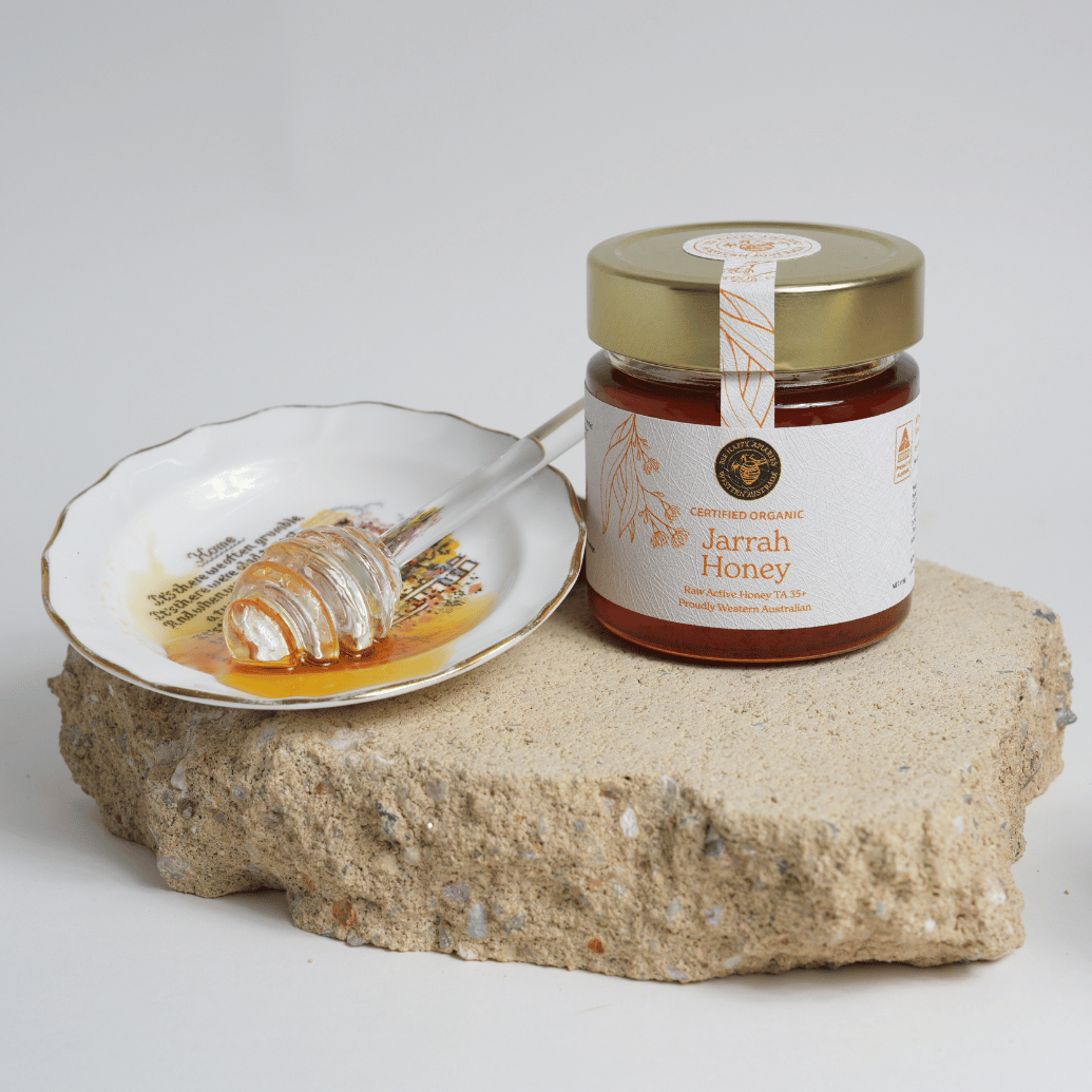 Certified organic jarrah honey with honey dripper