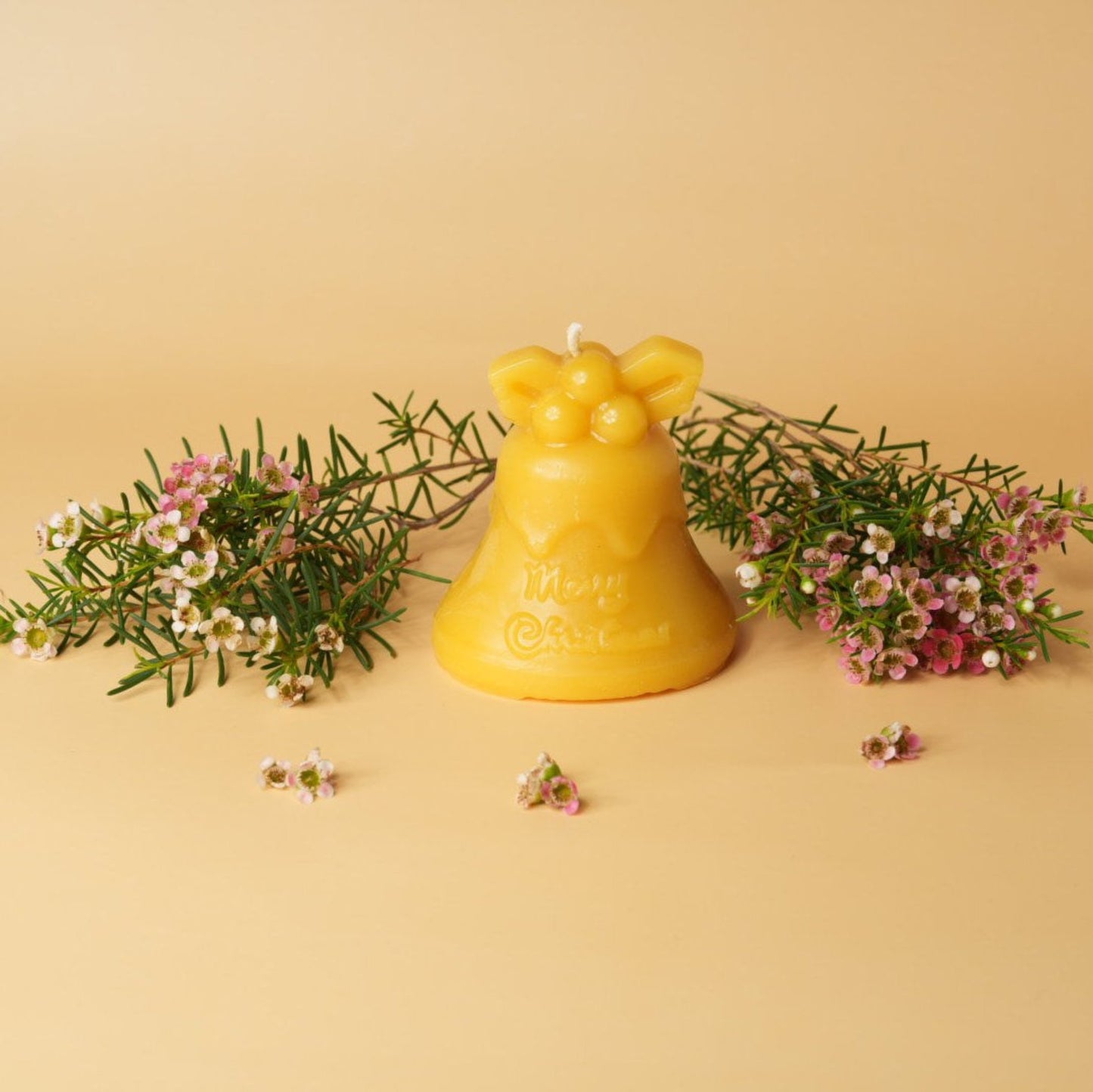 Beeswax candle in Christmas bell