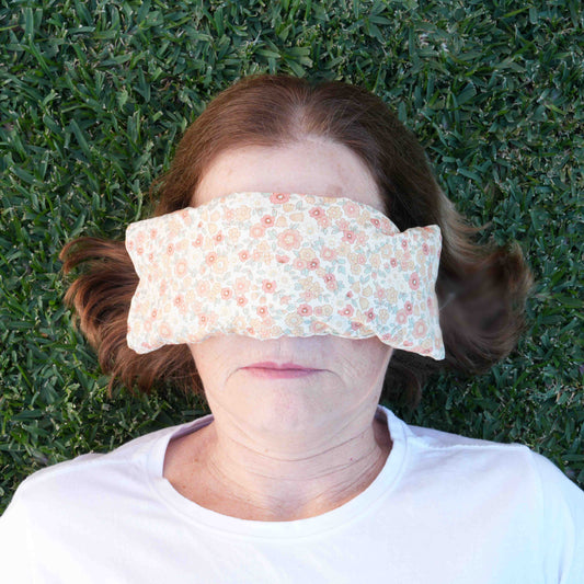 Cotton eye pillow with linseed and lavender worn by Louise