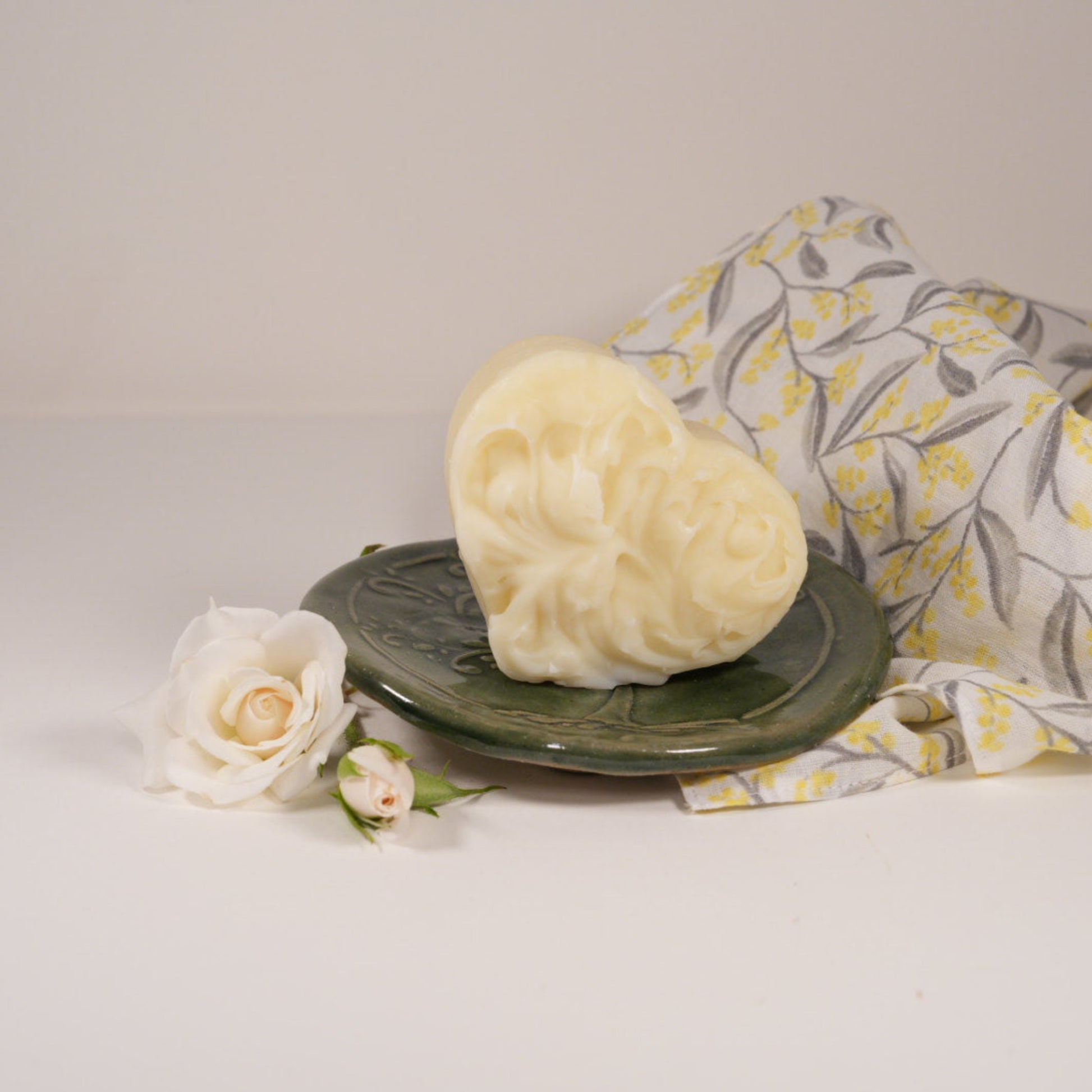 Eucalyptus Cleansing Soap Heart on round olive green soap dish with wattle face cloth