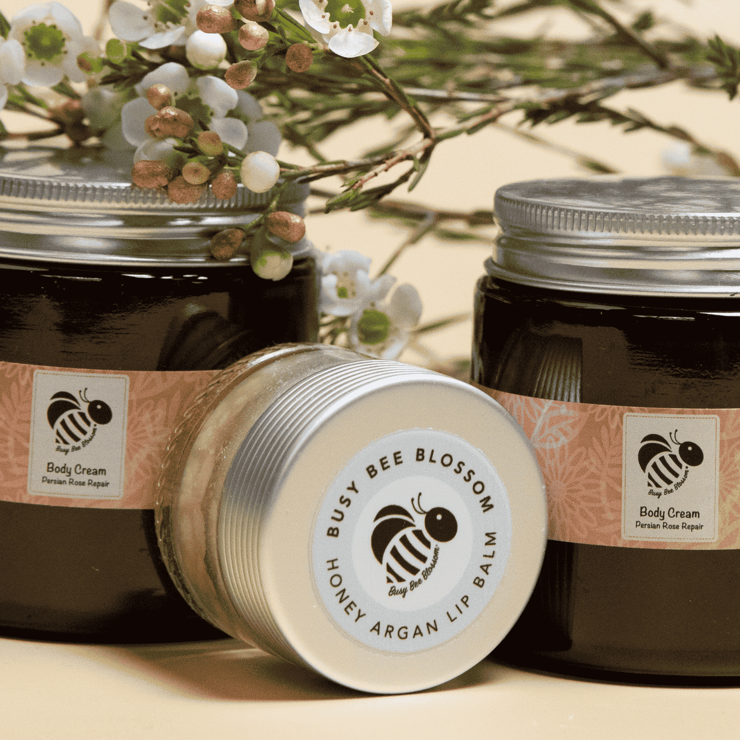 Honey argan lip balm with Body Creams and flowers.