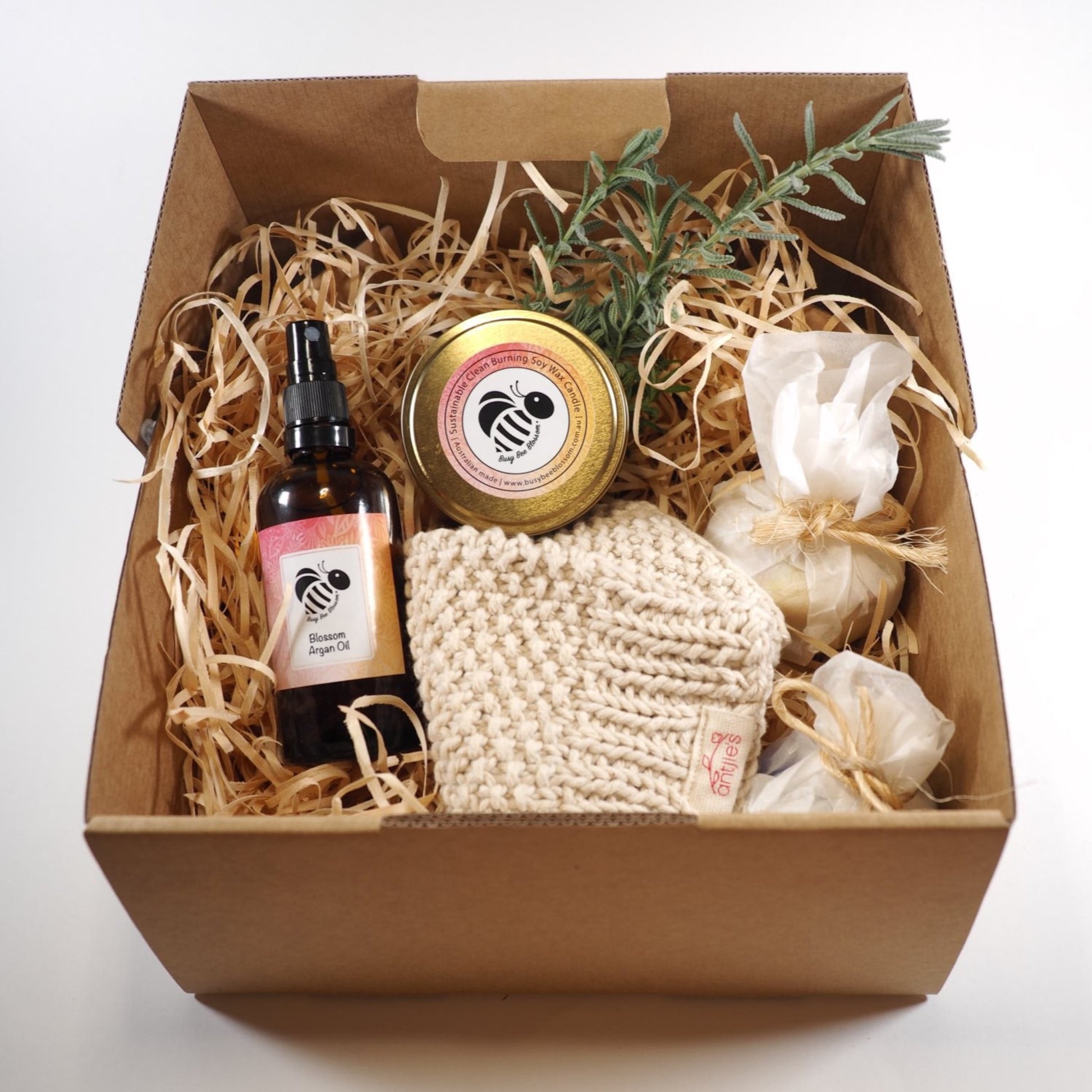 Exfoliation Superhero gift set contains Argan Oil, shower mitt, cleansing bars and coconut soy candle