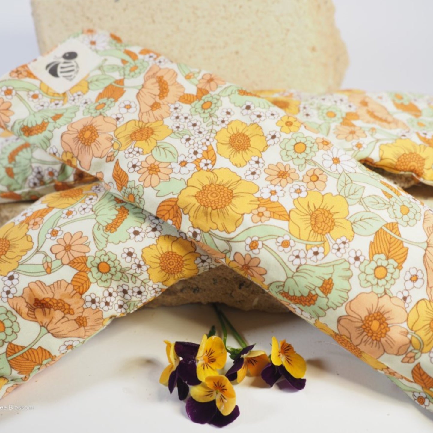 Lavender eye pillows in organic cotton poplin fabric with floral blossoms.